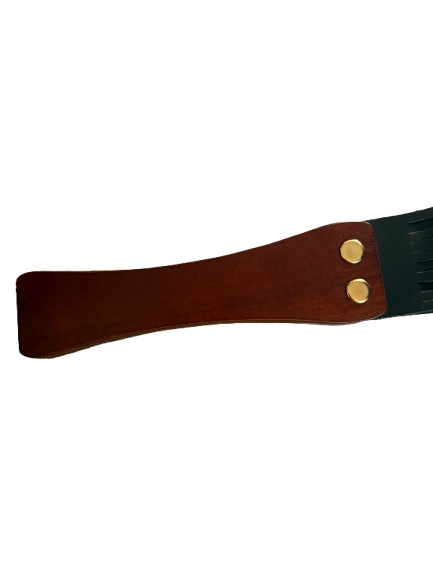 Wooden handle of leather flogger showing grain and finish detail