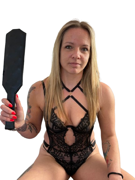 Woman holding Black leather spanking paddle