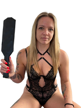 Load image into Gallery viewer, Woman holding Black leather spanking paddle
