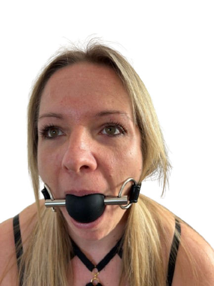 Person wearing a Black silicone ball gag with adjustable leather strap