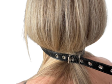 Load image into Gallery viewer, Rear view of ball gag showing strap holes and buckle