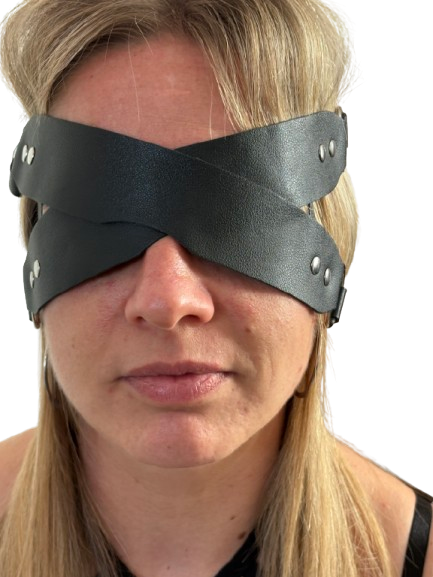 Person wearing Black leather BDSM blindfold with soft padded lining