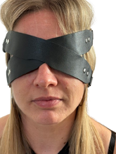 Load image into Gallery viewer, Person wearing Black leather BDSM blindfold with soft padded lining